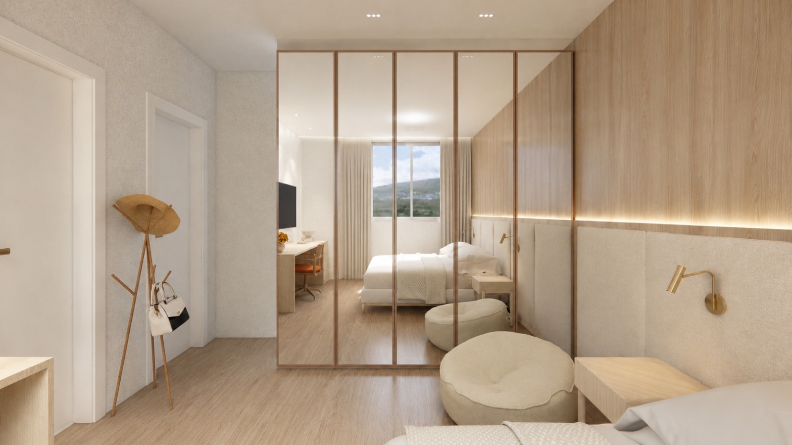 Suíte — closet espelhado com perfis em bronze e marcenaria em madeira clara